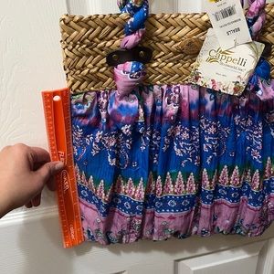 Straw and fabric tote.  Pink purple blue green